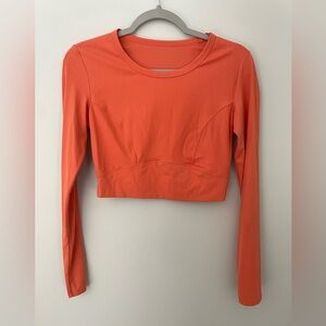 Orange athletic long sleeve crop top